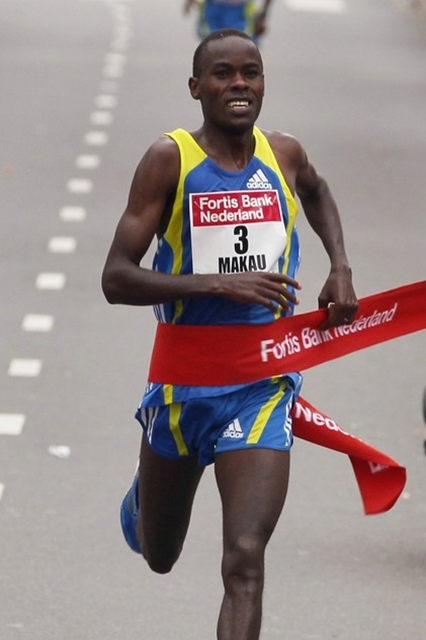 Patrick Makau of Kenya celebrates his victory at the finish line of the Fortis Marathon in Rotterdam